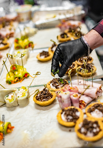 Chef hand is in process of Preparing catering food