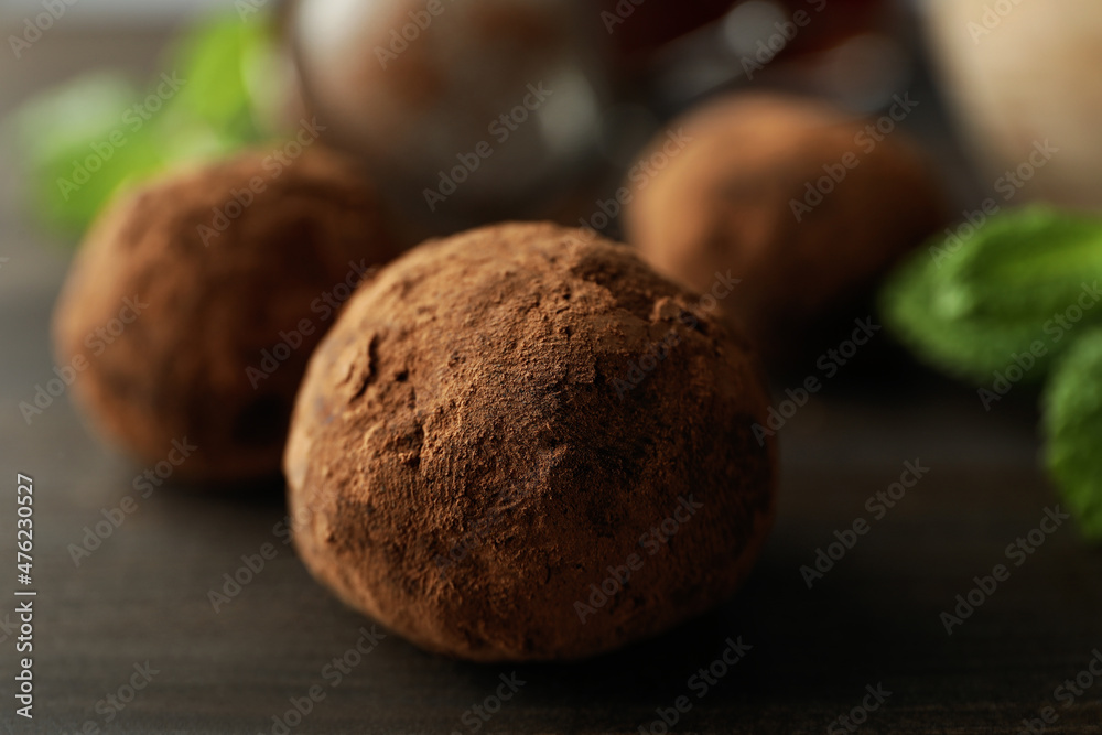 Concept of sweets with truffles on dark wooden background Concept of sweets with truffles on dark wooden background