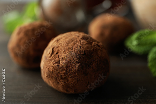 Concept of sweets with truffles on dark wooden background