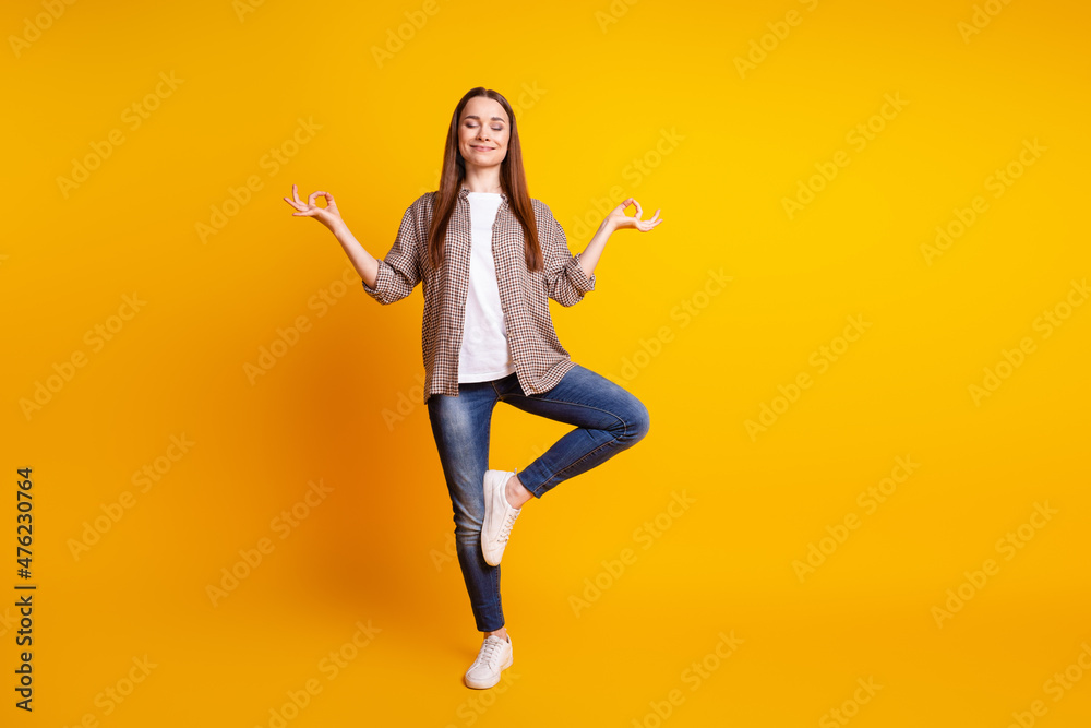 Full size photo of young pretty lady meditate dreamy balance concentration isolated over yellow color background