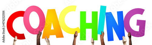 Coaching - human hands holding colorful letters photo