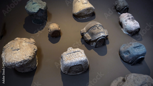 Idian culture. Inca. Larco Museum Lima Peru. Stone Masks. Stone carving.  photo