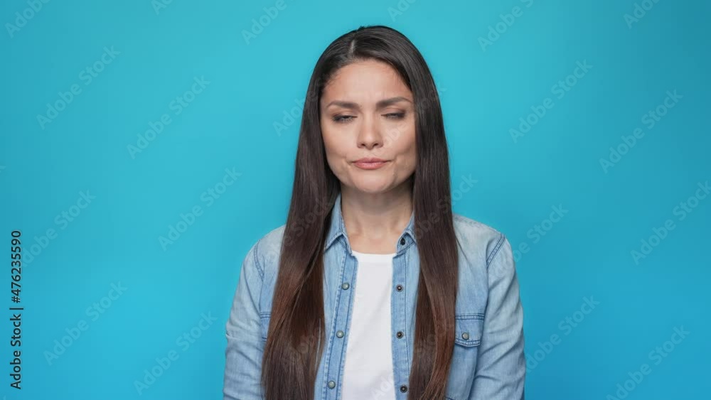 Lady put finger mouth ask keep silent isolated blue color background