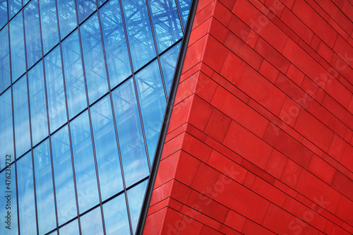 modern glass and red brick building with blue sky background. metal structure glass business center