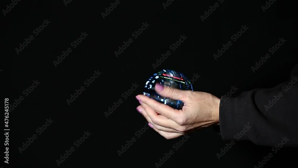 footage of spinner hand dark background