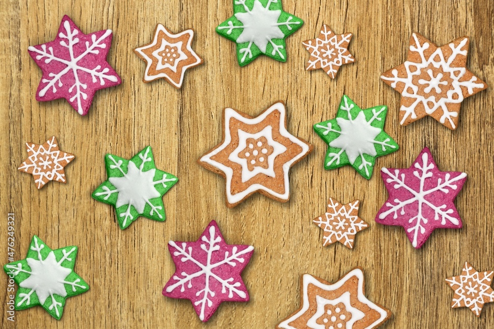 Gingerbread Snowflake cookies on wooden background Gingerbread Snowflake cookies on wooden background