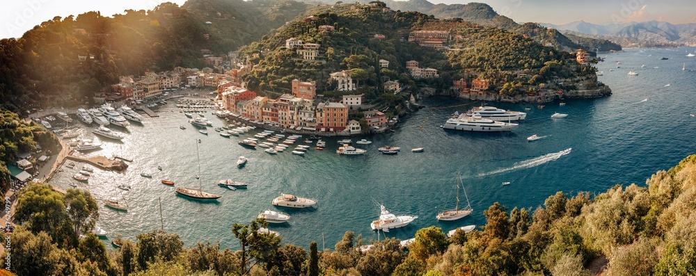 Portofino, one of the most visited and iconic Italian  village, Genoa province, Liguria - Italy. Panoramic view from above at sunset with natural colors - obrazy, fototapety, plakaty 