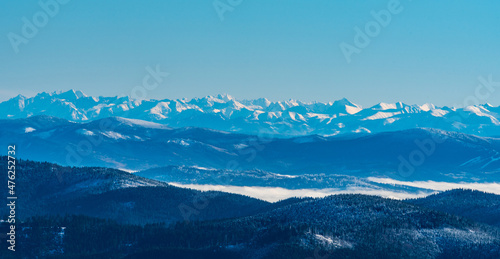 High Tatras and easternmost part of Western Tatras from Lysa hora hill in winter Moravskoslezske Beskydy mountains in Czech republic photo