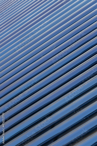 View of Solar panel tubes in a line as abstract patterns and background 
