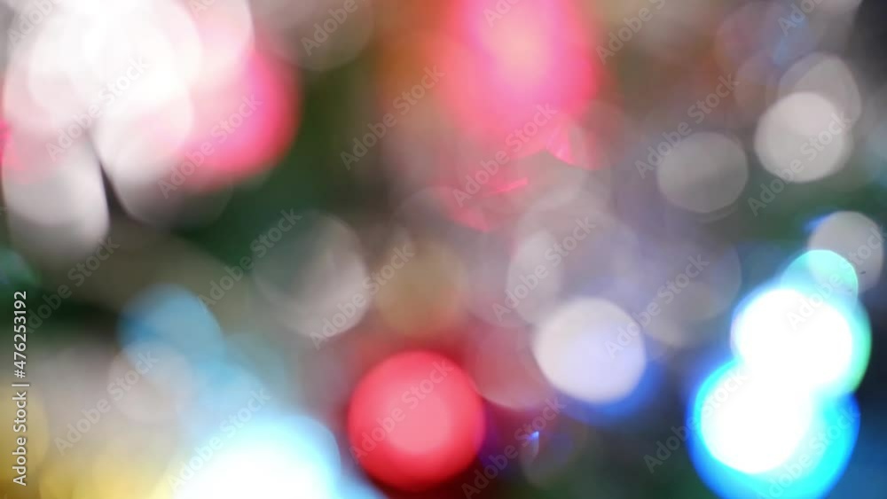 Defocusing a decorated Christmas tree. Bokeh glare is multicolored. Shiny spots Defocusing a decorated Christmas tree. Bokeh glare is multicolored. Shiny spots