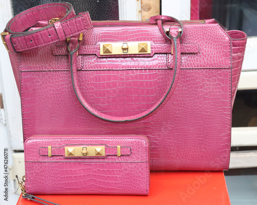 branded leather handbags on display