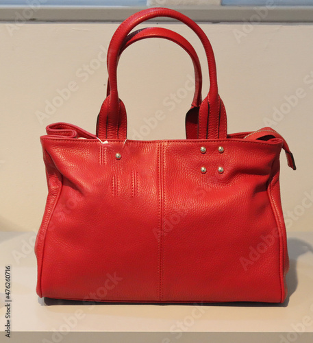 branded leather handbags on display
