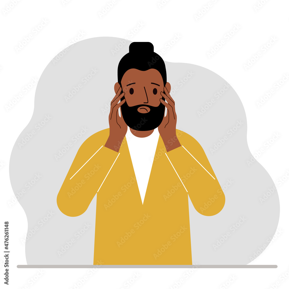 Unhappy man clutching his head with his hands. Emotions and body language concept. Stress, tension and migraine concept. Unhappy man clutching his head with his hands. Emotions and body language concept. Stress, tension and migraine concept.