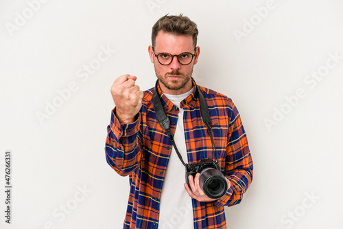 Young caucasian photograph man isolated on white background showing fist to camera, aggressive facial expression.