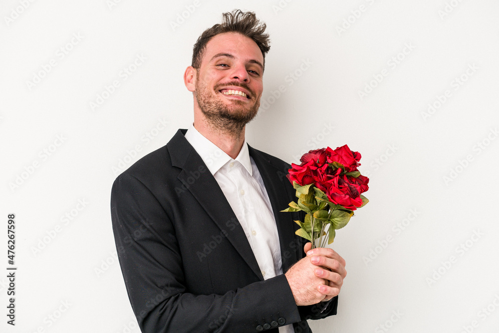 Young caucasian man holding bouquet of flowers isolated on white background Young caucasian man holding bouquet of flowers isolated on white background