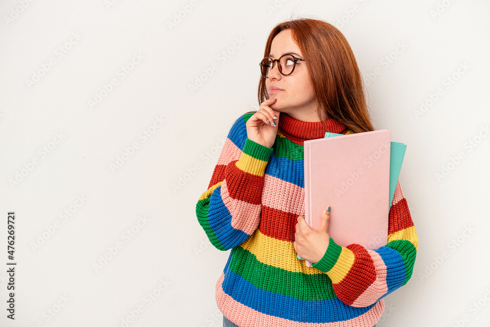 Young student caucasian woman isolated on white background looking sideways with doubtful and skeptical expression. Young student caucasian woman isolated on white background looking sideways with doubtful and skeptical expression.