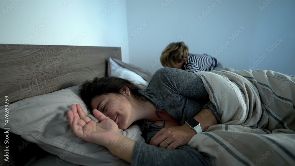 Mother lying in bed in the morning Mother lying in bed in the morning