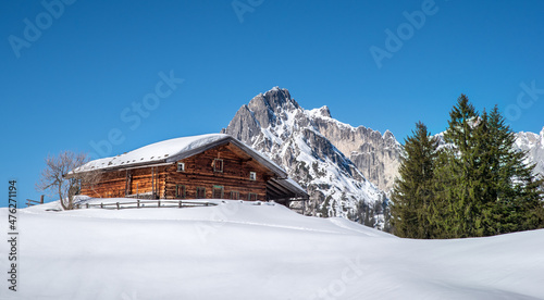 Traditional austrian alpine hut in an idyllic winter landscape, Salzburger Land, Austria