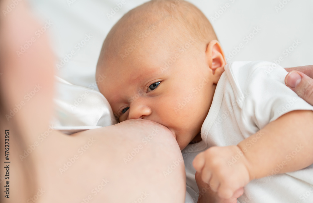 breastfeeding. view from above. the mother feeds the baby with breast milk. breastfeeding. view from above. the mother feeds the baby with breast milk.