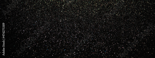 Black glowing glitter texture background. Festive banner