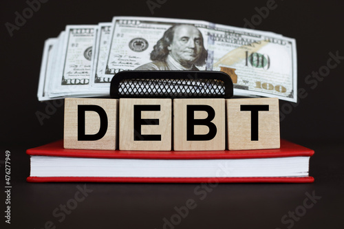 Wallpaper Mural DEBT the word on wooden cubes, Business and finance concept Torontodigital.ca