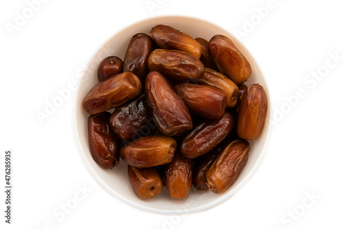 Dates on a white plate on a white background. Date isolate