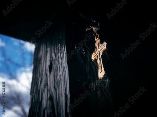 Orthodox cross hanging at the entrance to the dwelling, a tribute to the faith that the cross removes damage and spells of unkind people photo