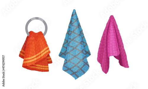 Bath towels set. Orange, blue and red soft textile cloth for wiping hanging on hooks vector illustration