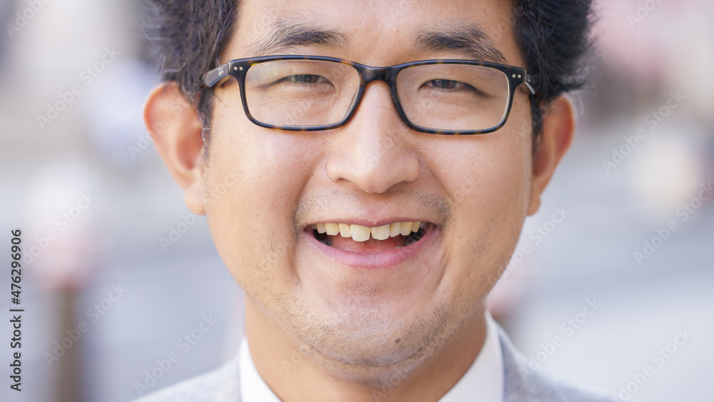 Portrait of smiling Asian business man laughing to camera Portrait of smiling Asian business man laughing to camera