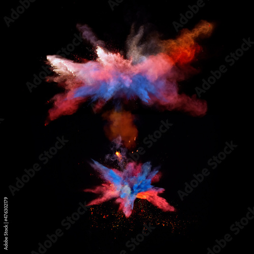 Bizarre forms of red and blue powder paint explode in front of a black background to give off fantastic multi colors and forms. © Brigitte