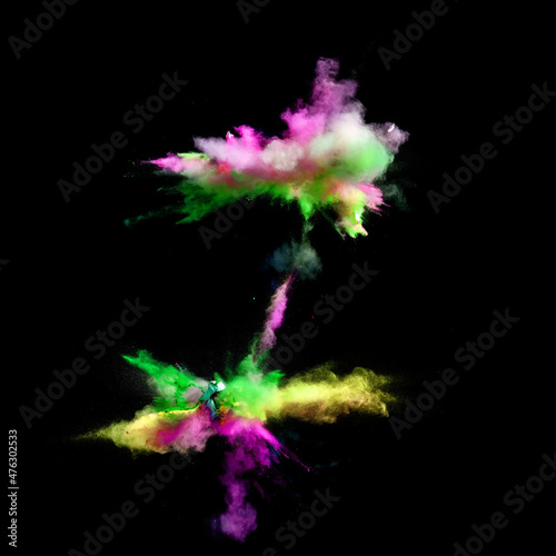 Multi colors of powder paint explode in front of a black background to give off fantastic abstract forms of powder paint.
