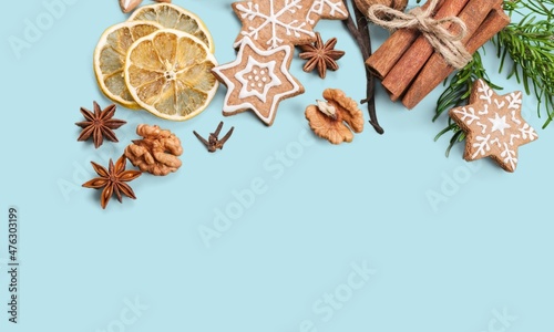 Collection of Christmas objects and cookies on the colored background