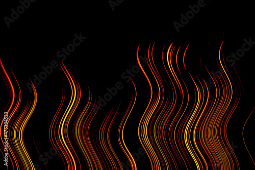 Orange yellow wavy vertical lines on a black background. Simulated fire. Bright orange-black abstract background. 