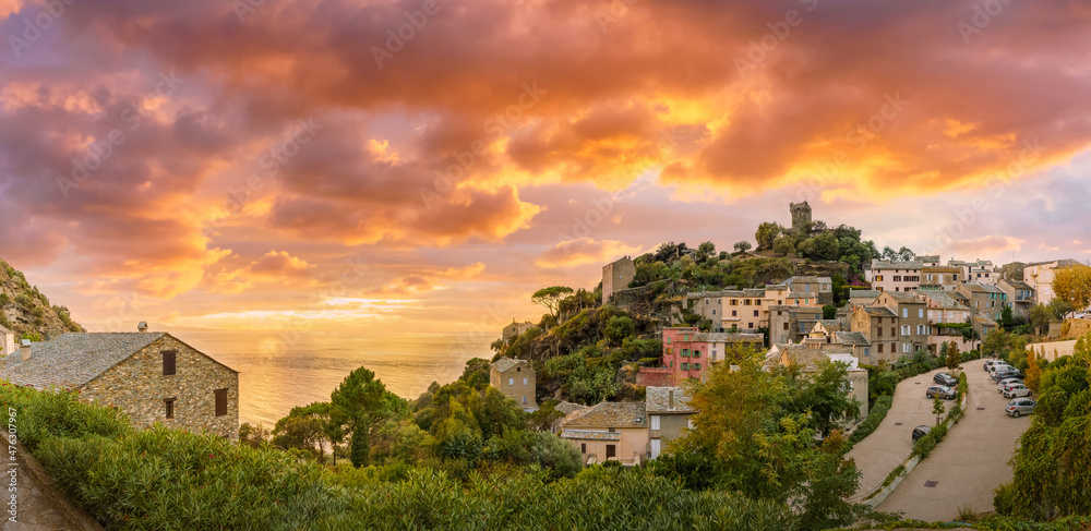 Landscape with Nonza village at sunset time, Corsica island, France