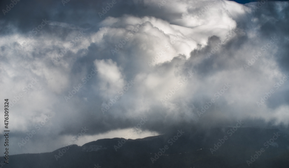 Winter mountains with snow under a dark winter sky. Winter mountains with snow under a dark winter sky.