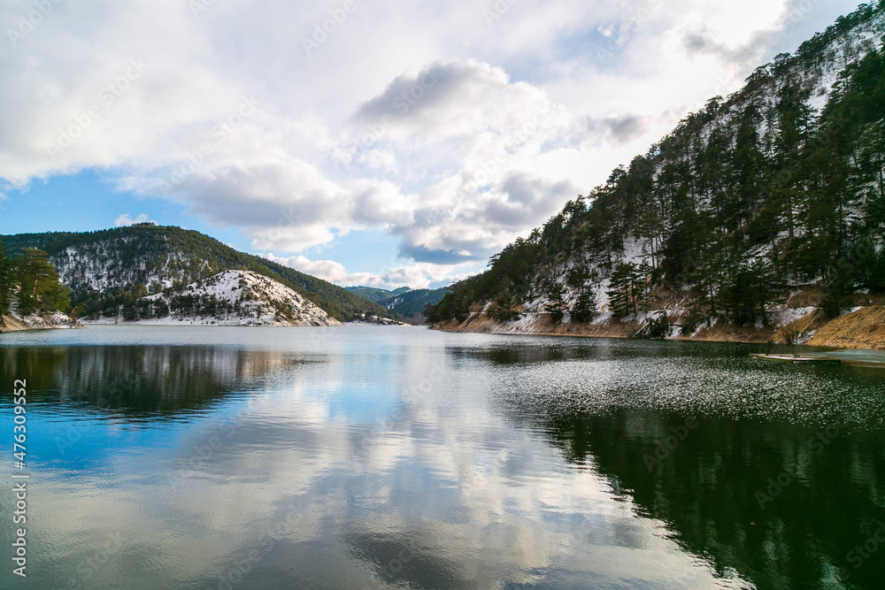 panoramic view of winter landscape. people walking on wooden walking path, with many snow and frozen trees. The Abant Lake Natural Park(Black Sea) Region. 