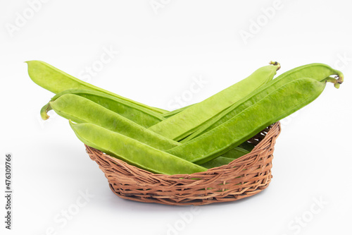 Flat Long Green Vegetable Runner Beans Known As Jhar Sim, Falia, Keralan, Sem Ki Phali, Surti Papdi, Guar Ki Fali, Gawar Isolated On White Background. Used To Cook Curry Bhaji Sabji Or Hari Sabzi photo