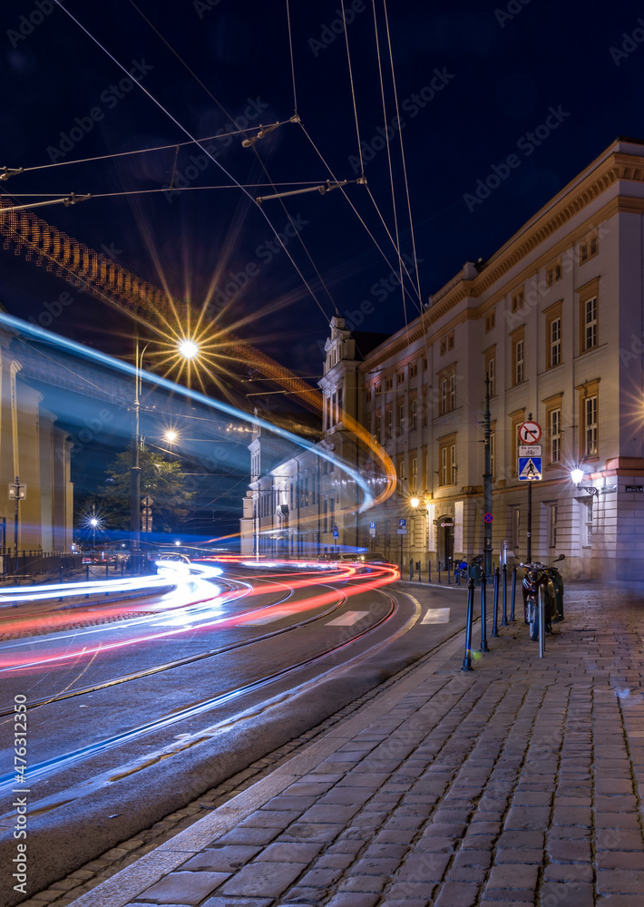 Krakow, Poland, tram light trails on Franciszkanska street in Old Town