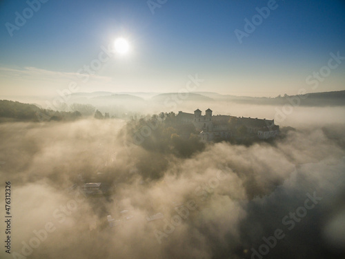 Aerial view of Tyniec abbey in the morning mists  beautiful sunrise  Krakow  Poland