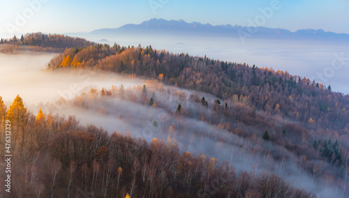 Fototapeta Naklejka Na Ścianę i Meble -  Misty autumn mountains landscape in the morning, Poland, Beskidy mountains and Tatra mountains in the background