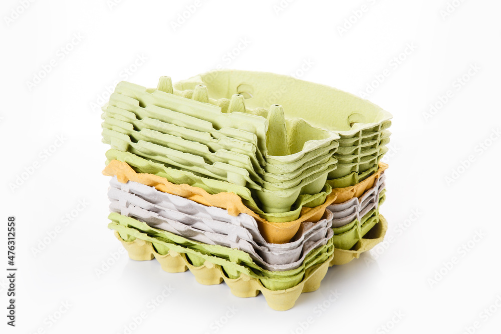 stack of egg trays from recycled paper garbage. Stuff for recycling on