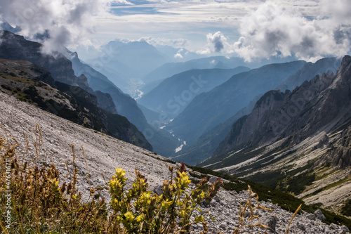 clouds over mountain trail Tre Cime di Lavaredo in Dolomites in Italy