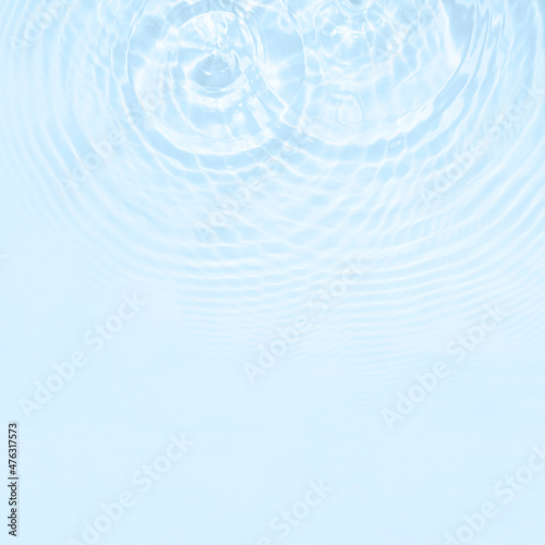 Water texture with circles on the water overlay effect for photo or mockup. Organic drop shadow caustic effect with wave refraction of light on a white or gray background. © esvetleishaya