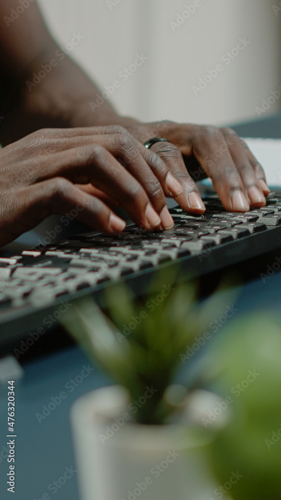 Close up of hands using computer keyboard and listening to music for business remote work. Man dancing and singing while working from home with technology. Worker having fun at desk Close up of hands using computer keyboard and listening to music for business remote work. Man dancing and singing while working from home with technology. Worker having fun at desk