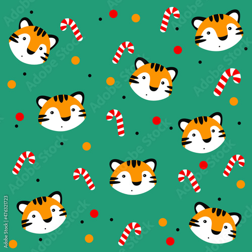 New year pattern. Candy  orange tiger head and balls on background.