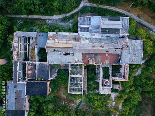 Ruined overgrown abandoned sugar factory in Ramon, aerial view