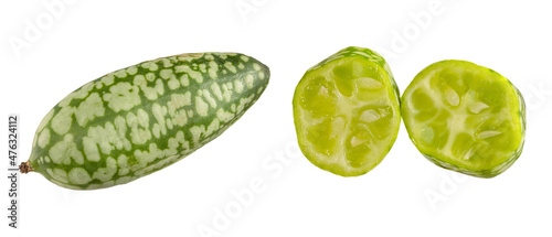   one whole and two pieces of melothria scabra , Mexican sour mini cucumber gherkin cut off and isolated on white background. photo
