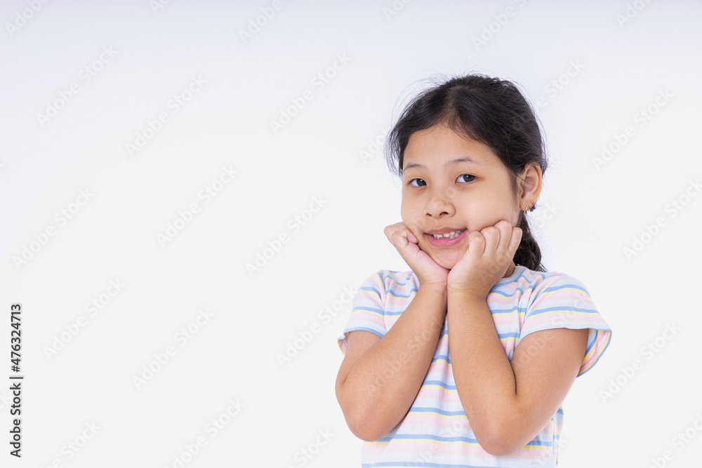 Portrait Asian kid girls are very cute smiles very happy, cheerful, bright, positive attitude. Photography standing in a studio with white background and copy space. Portrait Asian kid girls are very cute smiles very happy, cheerful, bright, positive attitude. Photography standing in a studio with white background and copy space.