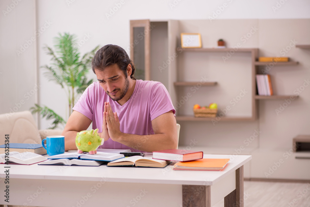 Young male student preparing for exams at home Young male student preparing for exams at home