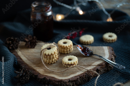 Linzer cookies, typical czech christmas candy, linecké, still life with homemade confectionery with currant jam, rustic serving, flower shape